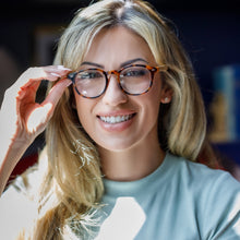 Woman Wearing Round Bamboo Frame Reading Glasses in Tortoise