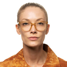 women wearing large cat eye reading glasses